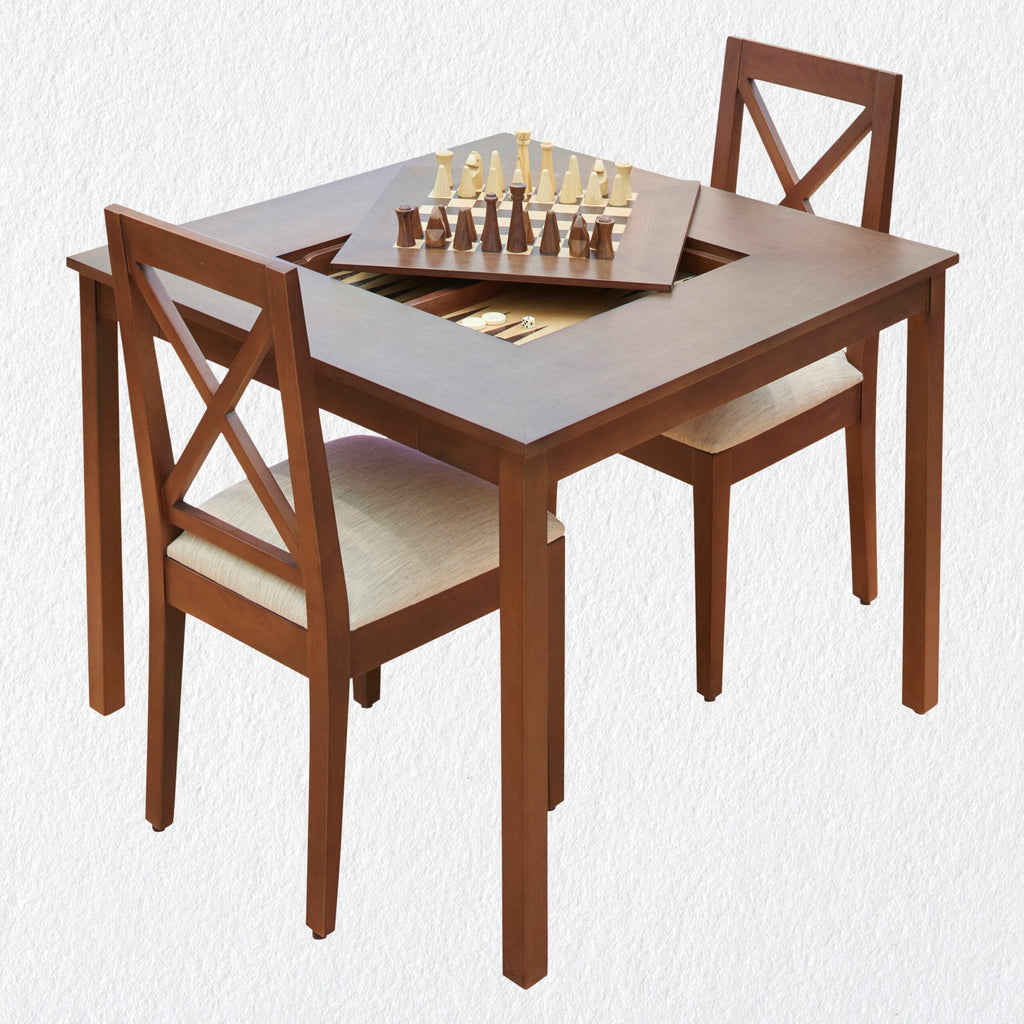 A wooden table with a chess board with two chairs set up for a game