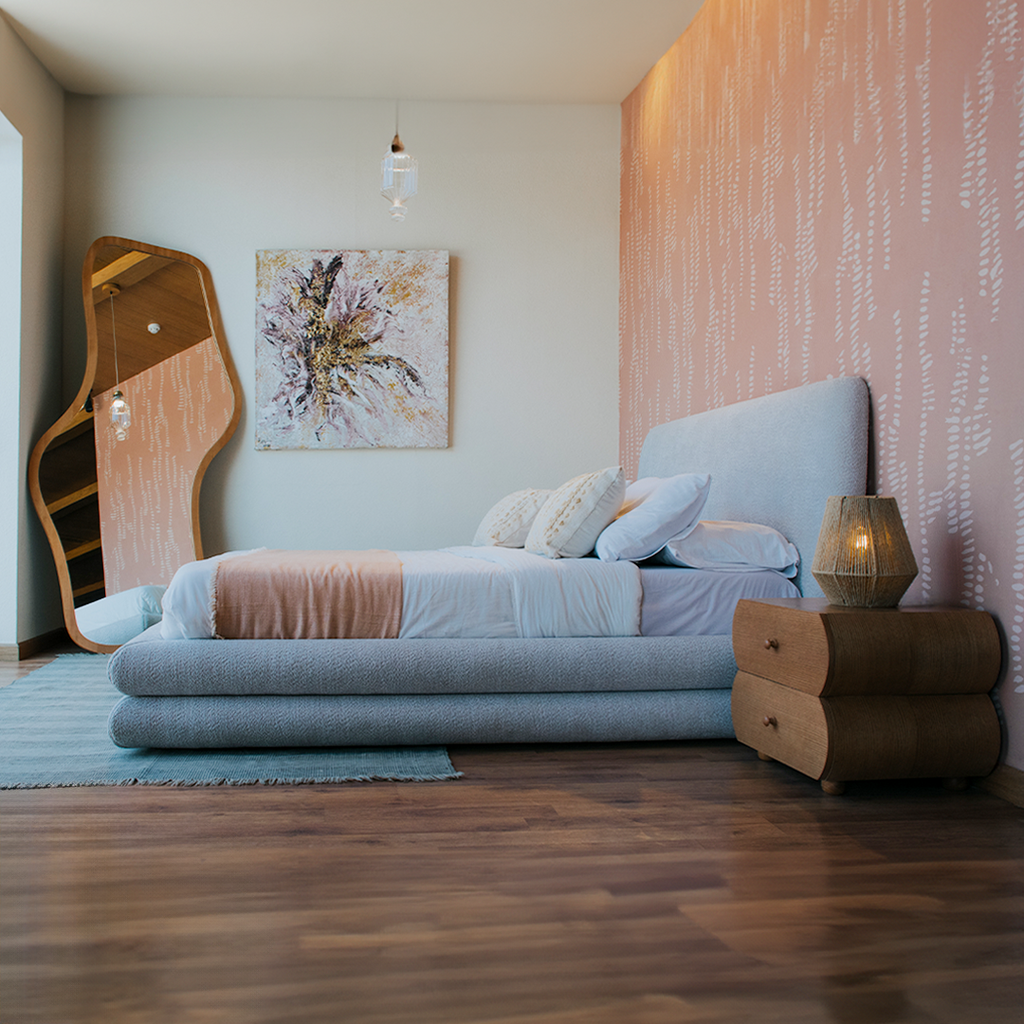  Interior of a bedroom featuring our bubbles bed, mirror, and wooden flooring.