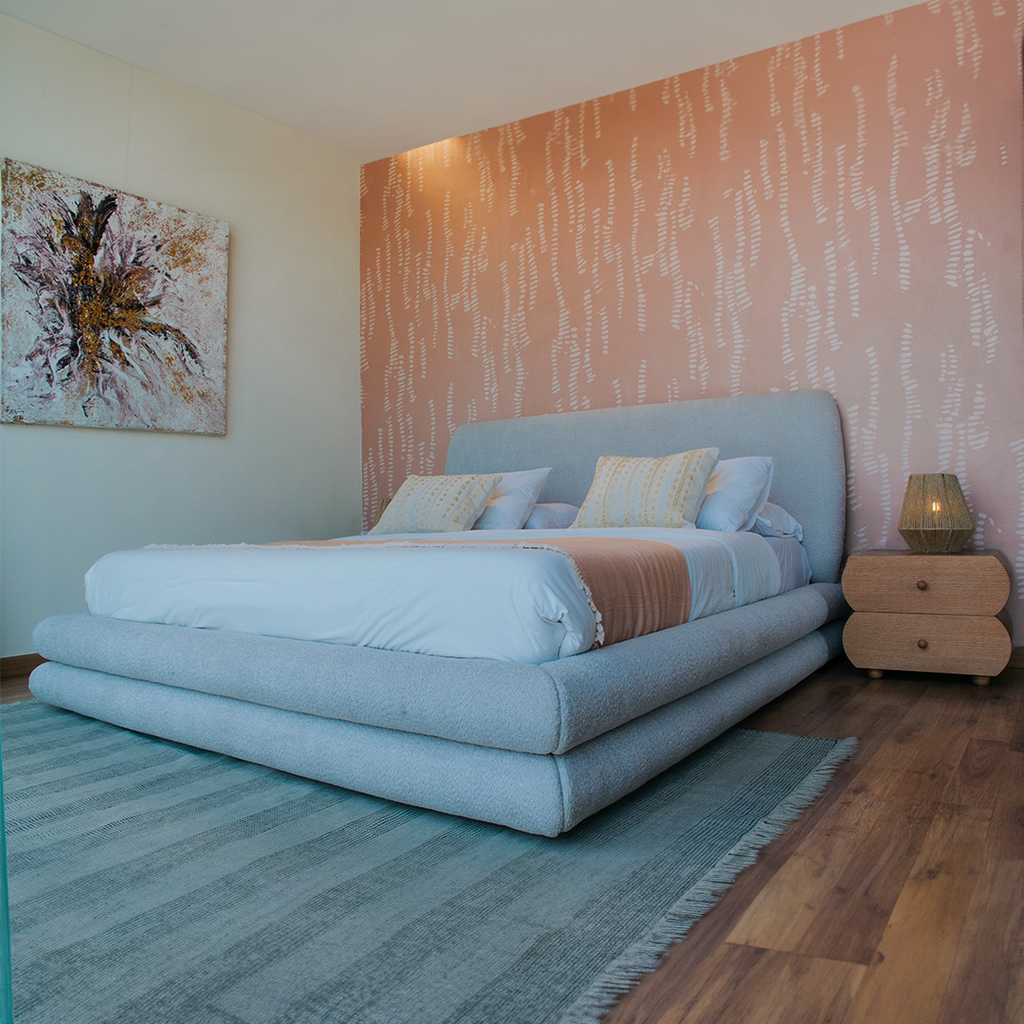 Cozy bedroom featuring a our bubbles bed and patterned wallpaper